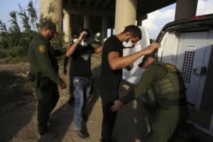 border patrol arresting illegal border crossers