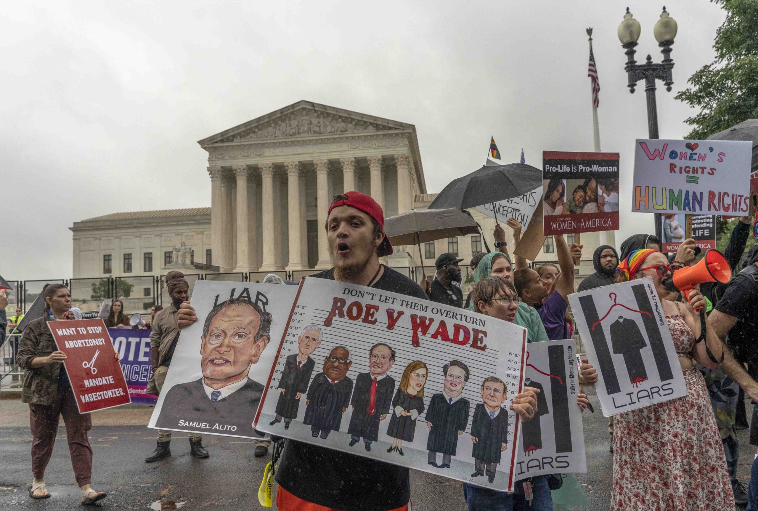 People protest about abortion, Thursday, June 23, 2022, outside the Supreme Court in Washington. (AP Photo/Gemunu Amarasinghe)
