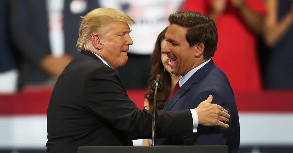 ESTERO, FL - OCTOBER 31:  President Donald Trump greets Florida Republican gubernatorial candidate Ron DeSantis during a campaign rally at the Hertz Arena on October 31, 2018 in Estero, Florida. President Trump continues traveling across America to help get the vote out for Republican candidates running for office.  (Photo by Joe Raedle/Getty Images)