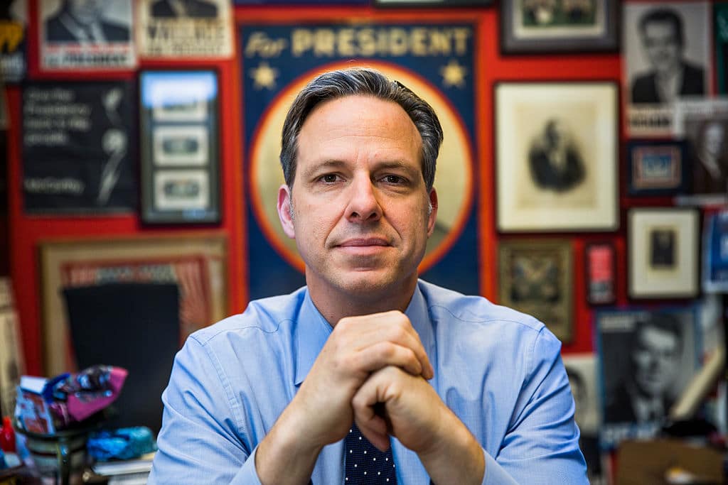 WASHINGTON, DC - MAY 16:  Jake Tapper is the Chief Washington Correspondent for CNN, and anchor of the CNN weekday television news show The Lead, May 16, 2016 in Washington, DC. Tapper's CNN office is decorated with posters from loosing U.S. Presidential campaigns over the decades.  (Photo by Brooks Kraft/ Getty Images)