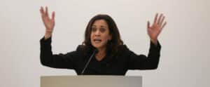 kamala harris with hands in the air