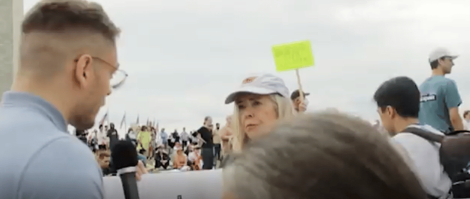 woman getting interviewed at gun protest