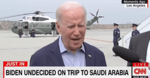Biden speaking on tv in front of helicopter