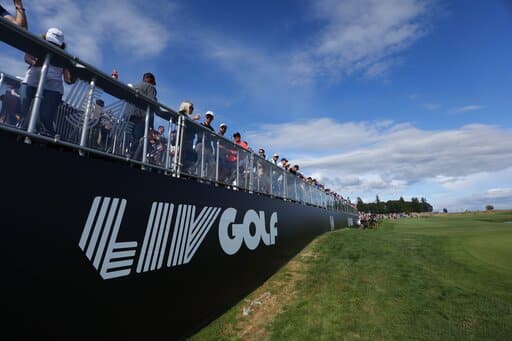 Fans await the final grouping at the 18th hole during the third round of the Portland Invitational LIV Golf tournament in North Plains, Ore., Saturday, July 2, 2022. (AP Photo/Steve Dipaola)