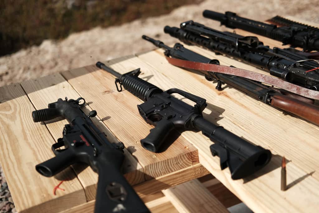 GREELEY, PENNSYLVANIA - OCTOBER 12: AR-15 rifles and other weapons are displayed on a table at a shooting range during the “Rod of Iron Freedom Festival” on  October 12, 2019 in Greeley, Pennsylvania. The two-day event, which is organized by Kahr Arms/Tommy Gun Warehouse and Rod of Iron Ministries, has billed itself as a “second amendment rally and celebration of freedom, faith and family.” Numerous speakers, vendors and displays celebrated guns and gun culture in America.  (Photo by Spencer Platt/Getty Images)