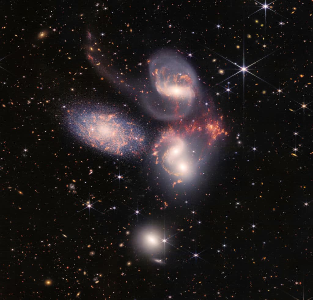 IN SPACE - JULY 12: In this handout photo provided by NASA, NASA's James Webb Space Telescope reveals Stephans Quintet, a visual grouping of five galaxies, in a new light on July 12, 2022 in space. This enormous mosaic is Webb's largest image to date, covering about one-fifth of the Moons diameter. It contains over 150 million pixels and is constructed from almost 1,000 separate image files. The information from Webb provides new insights into how galactic interactions may have driven galaxy evolution in the early universe.  (Photo by NASA, ESA, CSA, and STScI via Getty Images)