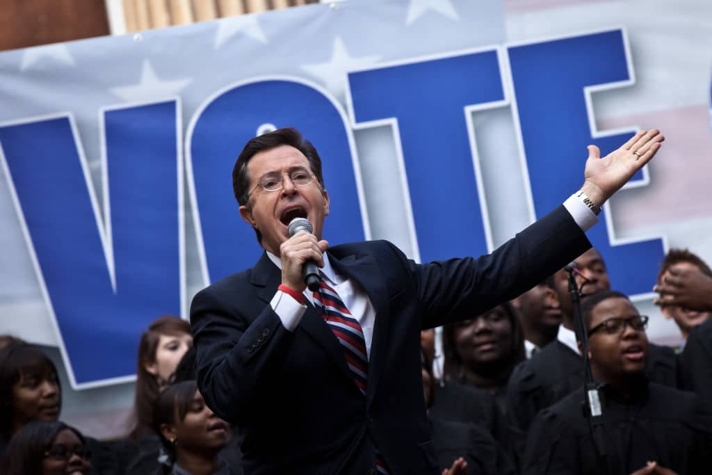 Comedian Stephen Colbert hosts a rally with former Republican presidential candidate Herman Cain at the College of Charleston on January 20, 2012 in Charleston, South Carolina.