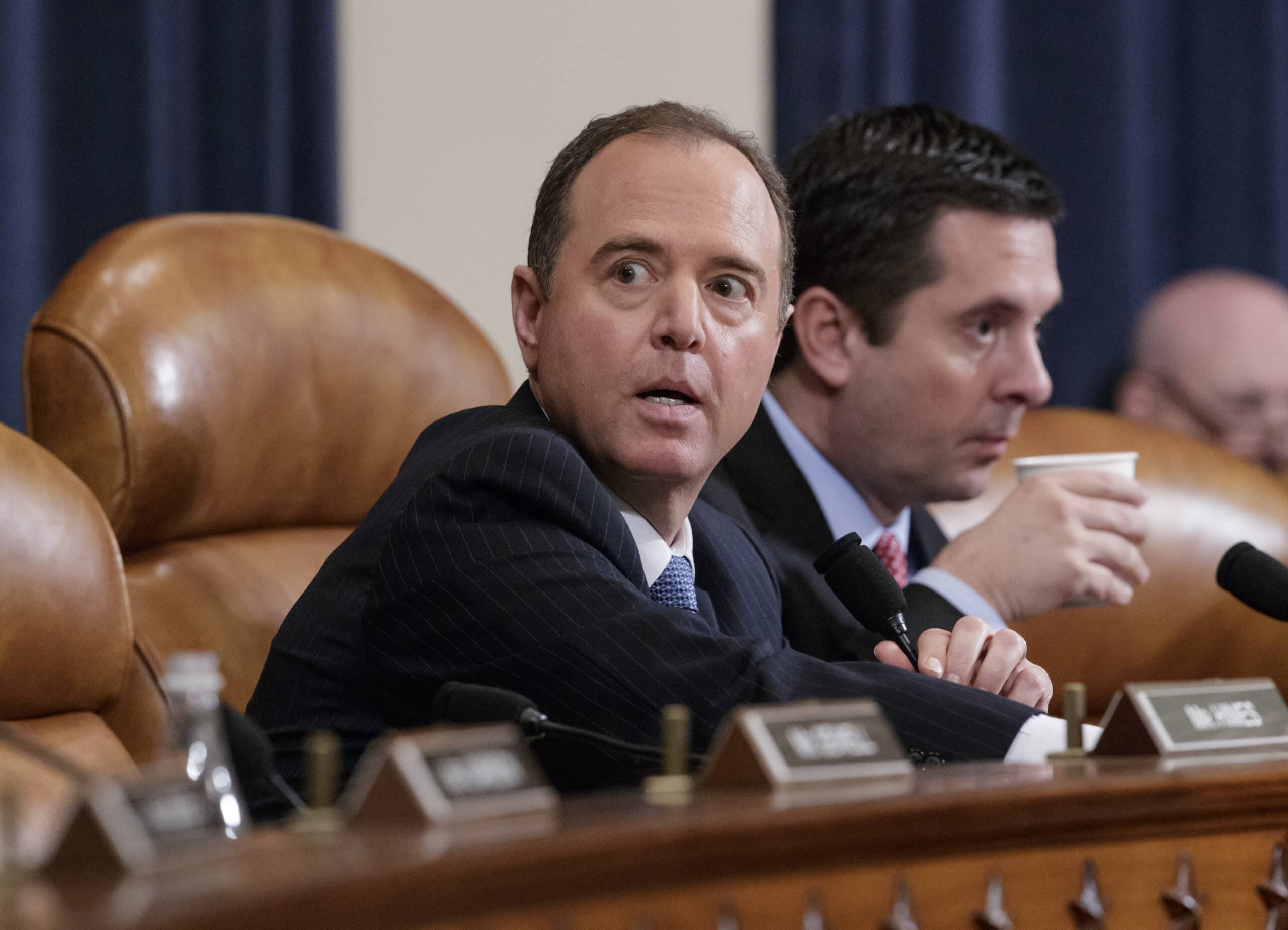 Rep. Adam Schiff, D-Calif., the ranking member, left, and Rep. Devin Nunes, R-Calif., the House Intelligence Committee chairman, listen as FBI Director James Comey testifies on Capitol Hill in Washington, Monday, March 20, 2017, before the House Intelligence Committee hearing on allegations of Russian interference in the 2016 U.S. presidential election. (AP Photo/J. Scott Applewhite)