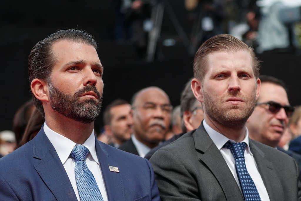 US businessmen and sons of the US president Donald Trump Jr. (L) and Eric Trump attend a French-US ceremony at the Normandy American Cemetery and Memorial in Colleville-sur-Mer, Normandy, northwestern France, on June 6, 2019, as part of D-Day commemorations marking the 75th anniversary of the World War II Allied landings in Normandy. (Photo by Ian LANGSDON / POOL / AFP)        (Photo credit should read IAN LANGSDON/AFP via Getty Images)