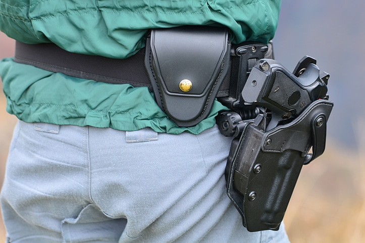 Midsection Of Man With Gun In Holster