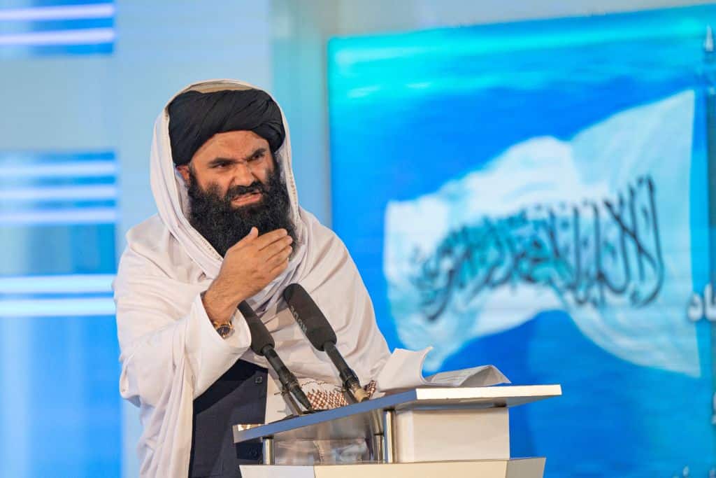 Taliban Interior Minister Sirajuddin Haqqani speaks during a ceremony marking the 30th anniversary of the Mujahideen, the 8th of Saur 1371 (28 April 1992) victory over the government of communist regime, in Kabul on April 28, 2022. (Photo by Wakil KOHSAR / AFP) (Photo by WAKIL KOHSAR/AFP via Getty Images)