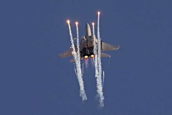 A F-15 fighter jet takes part in an aerial display during the graduation ceremony of Israeli air force pilots at the Hatzerim base in the Negev desert, on June 23, 2022. (Photo by Menahem KAHANA / AFP) (Photo by MENAHEM KAHANA/AFP via Getty Images)