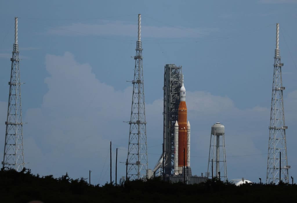 CAPE CANAVERAL, FLORIDA - AUGUST 28: The Artemis I rocket sits on launch pad 39-B at Kennedy Space Center as it is prepared for launch of an unmanned flight around the moon on August 28, 2022 in Cape Canaveral, Florida. The launch is scheduled for Monday between 8:33am and 10:33am and would be the furthest into space any unmanned vehicle intended for humans has ever traveled before. (Photo by Joe Raedle/Getty Images)