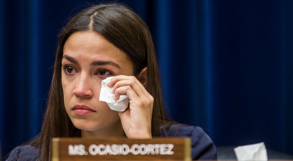 WASHINGTON, DC - JULY 10: Rep. Alexandria Ocasio-Cortez (D-NY) wipes a tear during a House Oversight and Reform subcommittee on Civil Rights and Civil Liberties hearing discussing migrant detention centers' treatment of children on Capitol Hill on July 10, 2019 in Washington, DC. Yazmin Juarez, whose 19-month-old daughter Mariee died after detention by ICE testified. (Photo by Zach Gibson/Getty Images)