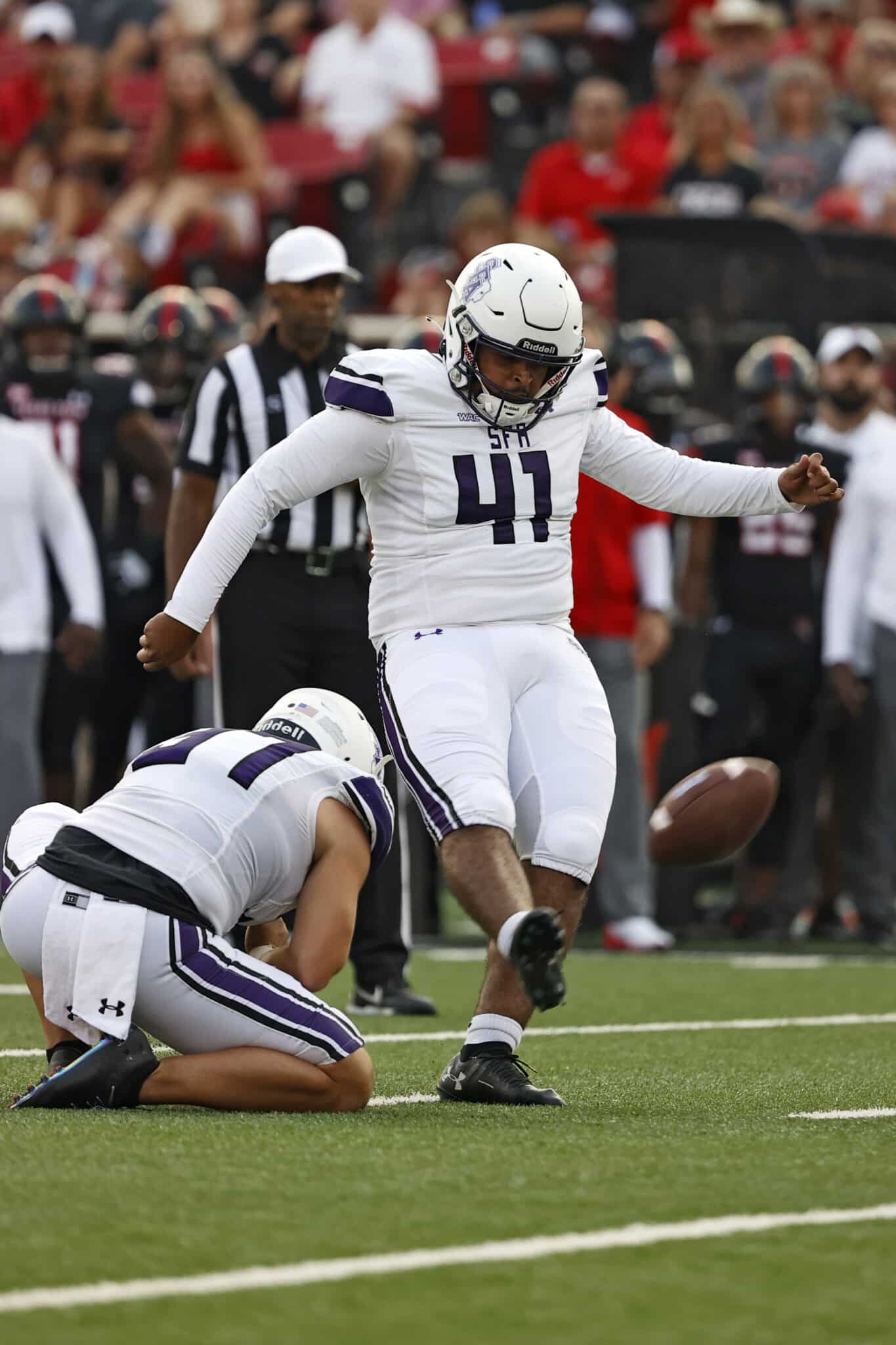 Stephen F. Austin's Chris Campos (41) kicks a field goal during the first half of an NCAA college football game against Texas Tech, Saturday, Sept. 11, 2021, in Lubbock, Texas. (AP Photo/Brad Tollefson)