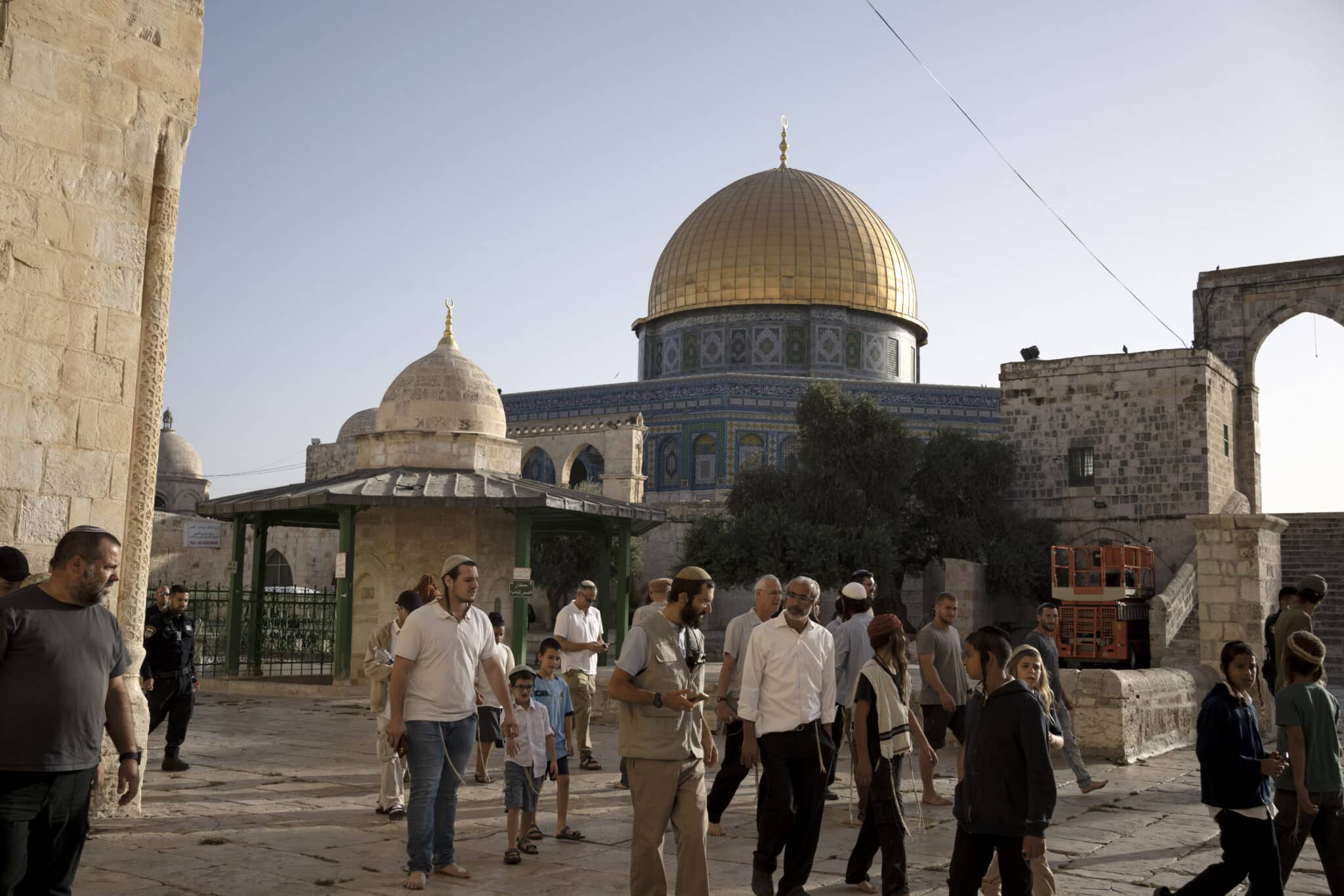 Jews visit the Temple Mount, known to Muslims as the Noble Sanctuary, on the Al-Aqsa Mosque compound in the Old City of Jerusalem, on the morning before Rosh Hashana, the Jewish New Year, which begins at sundown, Sunday, Sept. 25, 2022. (AP Photo/ Maya Alleruzzo)