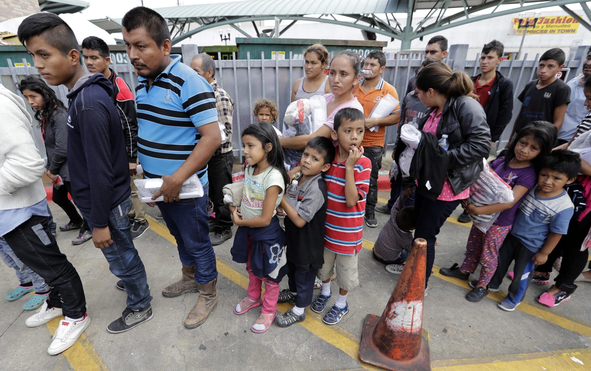 Immigrant families line up to enter the central bus station after they were processed and released by U.S. Customs and Border Protection, Sunday, June 24, 2018, in McAllen, Texas. (AP Photo/David J. Phillip, File)