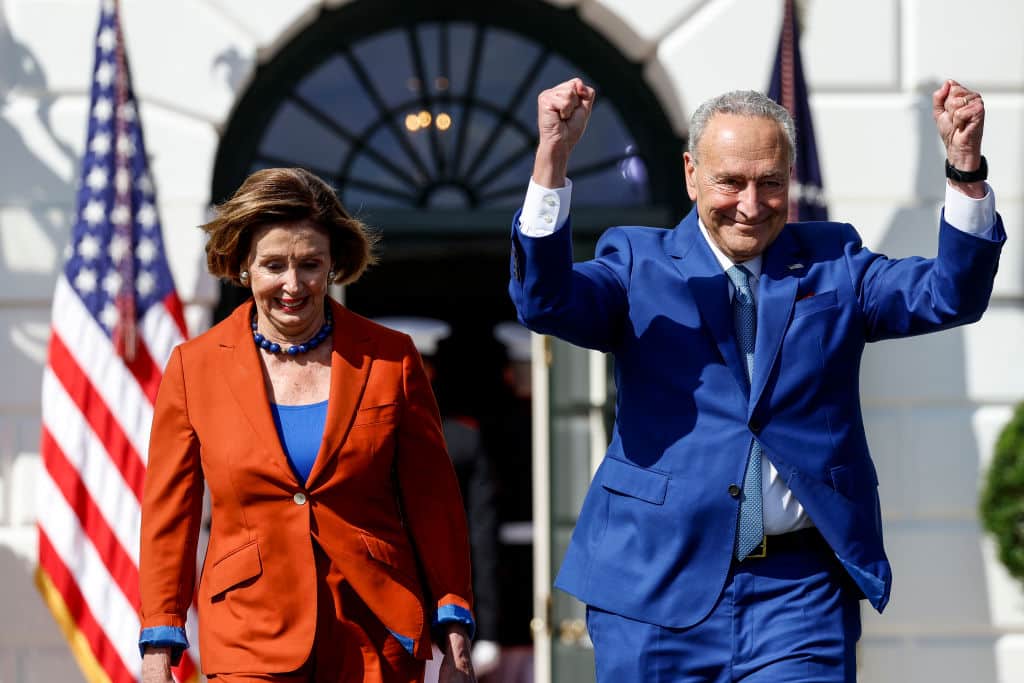 WASHINGTON, DC - SEPTEMBER 13: U.S. Speaker of the House Nancy Pelosi (D-CA) and Senate Majority Leader Chuck Schumer (D-NY) arrive to an event celebrating the passage of the Inflation Reduction Act on the South Lawn of the White House on September 13, 2022 in Washington, DC. H.R. 5376, the Inflation Reduction Act of 2022 was passed by the House and Senate and later signed by Biden in August. (Photo by Anna Moneymaker/Getty Images)