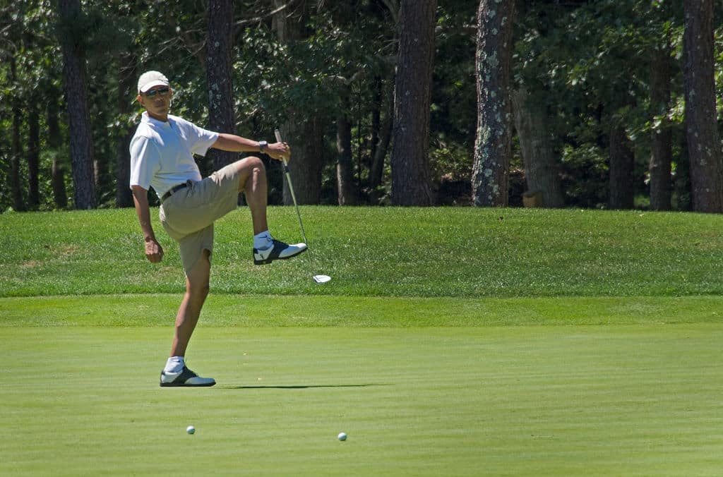 US President Barack Obama reacts to a missed putt on the first green at Farm Neck Golf Club in Oak Bluffs, Massachusetts, August 11, 2013 during the Obama family vacation to Martha's Vineyard.    AFP PHOTO/Jim WATSON (Photo by Jim WATSON / AFP) (Photo by JIM WATSON/AFP via Getty Images)