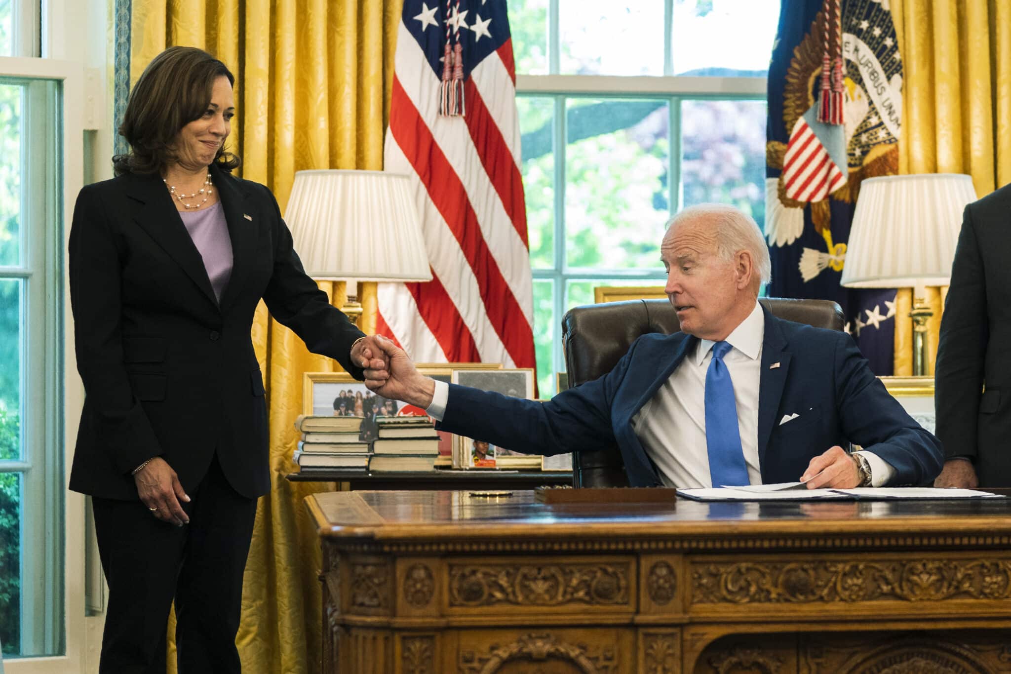 President Joe Biden acknowledges Vice President Kamala Harris during the signing of the Ukraine Democracy Defense Lend-Lease Act of 2022 in the Oval Office of the White House, Monday, May 9, 2022, in Washington. (AP Photo/Manuel Balce Ceneta)