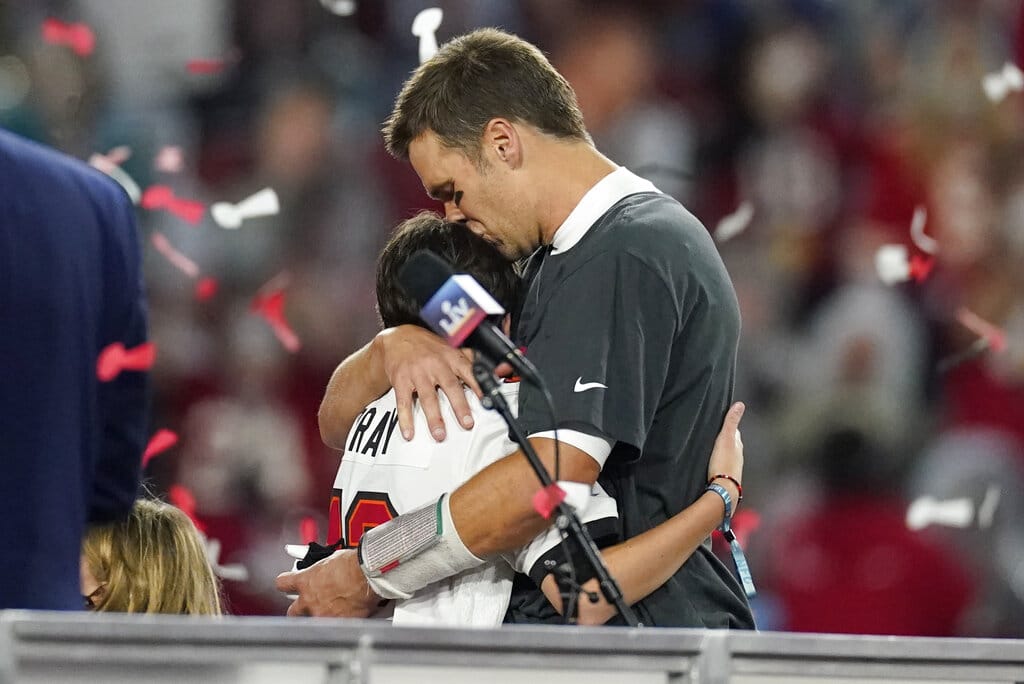 Tampa Bay Buccaneers quarterback Tom Brady embraces one of his children after defeating the Kansas City Chiefs in the NFL Super Bowl 55 football game Sunday, Feb. 7, 2021, in Tampa, Fla. The Buccaneers defeated the Chiefs 31-9 to win the Super Bowl. (AP Photo/Ashley Landis)