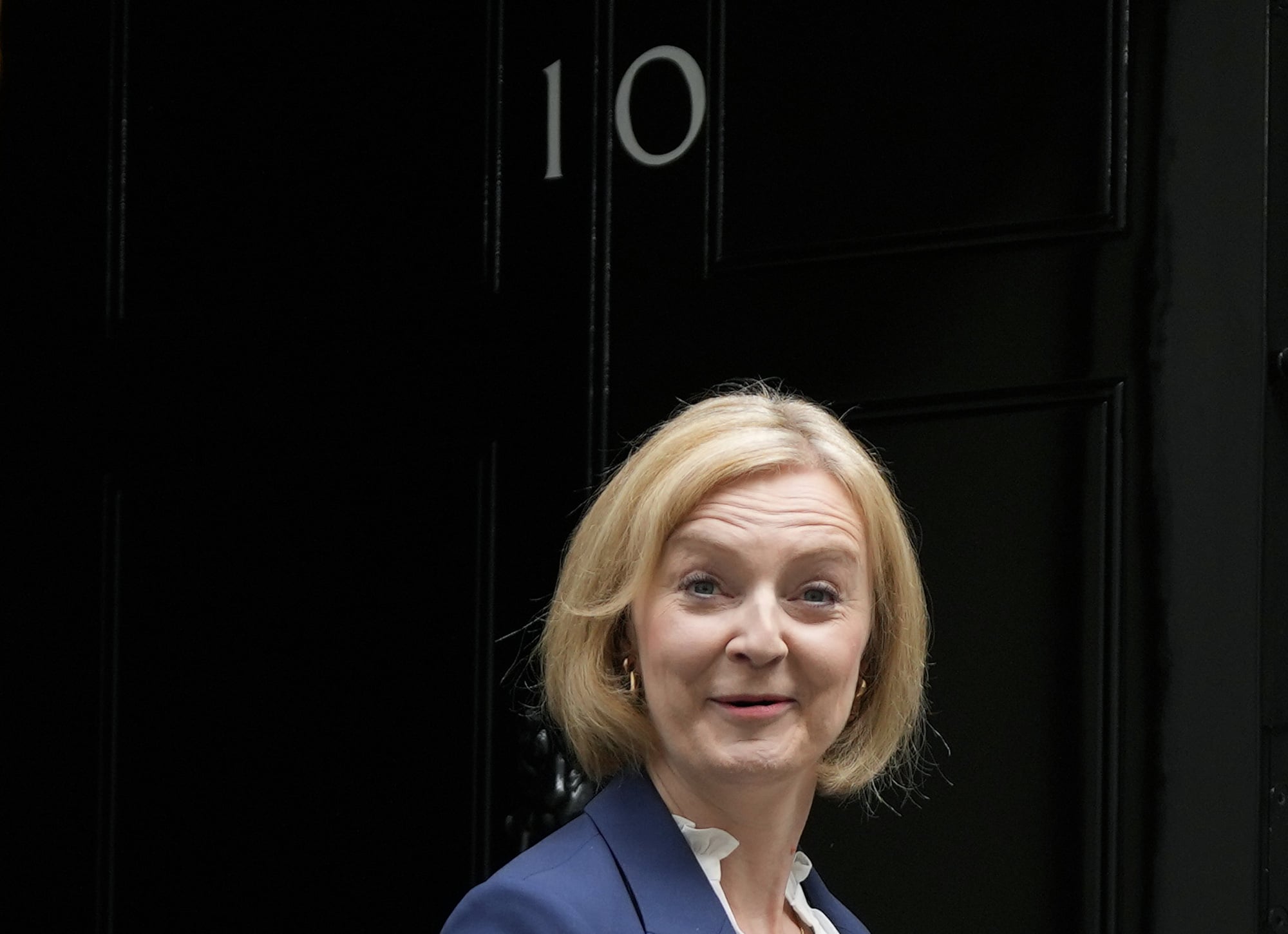 FILE - British Prime Minister Liz Truss leaves 10 Downing Street to attend her first Prime Minister's Questions at the Houses of Parliament, in London, Wednesday, Sept. 7, 2022. On Thursday, Oct. 20, 2022 Truss quit after losing support of Conservative lawmakers following weeks of turmoil over botched economic plan. (AP Photo/Frank Augstein, File)