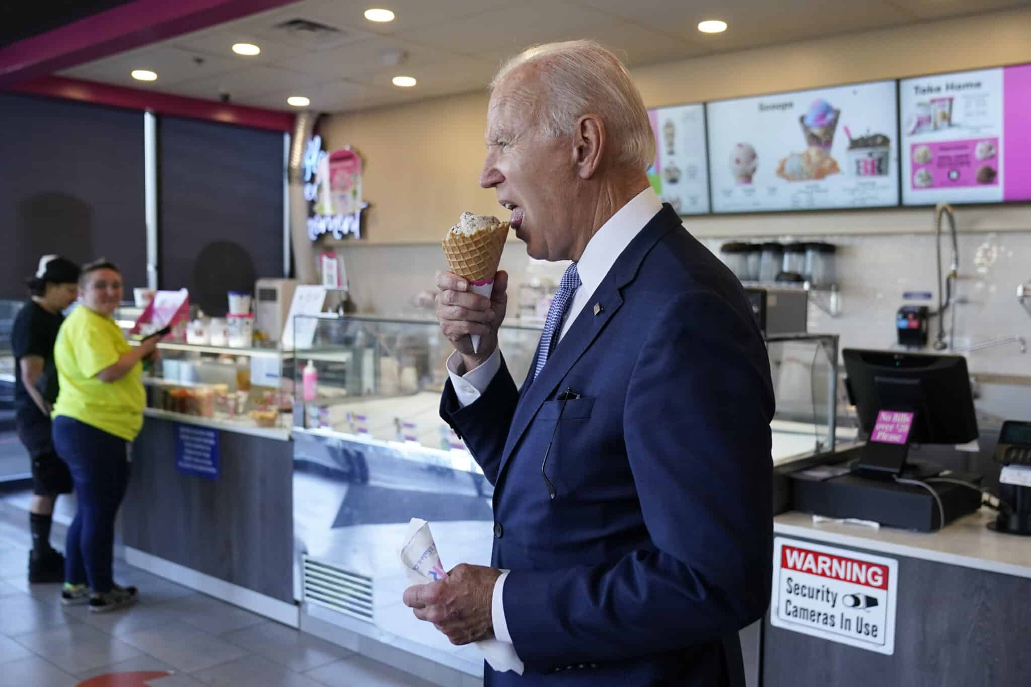 President Joe Biden eats an ice cream cone at a Baskin-Robbins in Portland, Ore., Saturday, Oct. 15, 2022. (AP Photo/Carolyn Kaster)