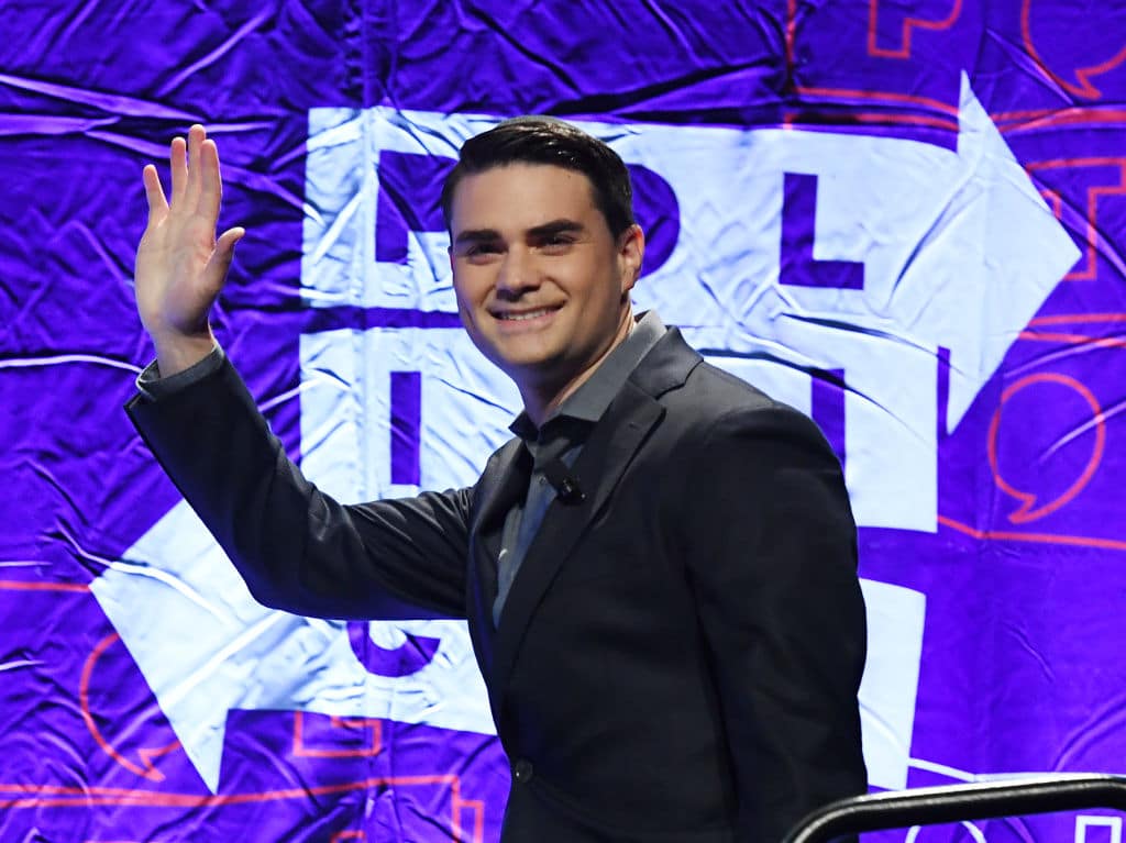 Conservative political commentator, writer and lawyer Ben Shapiro waves to the crowd as he arrives to speak at the 2018 Politicon in Los Angeles, California on October 21, 2018. - The two day event covers all things political with dozens of high profile political figures. (Photo by Mark RALSTON / AFP)        (Photo credit should read MARK RALSTON/AFP via Getty Images)