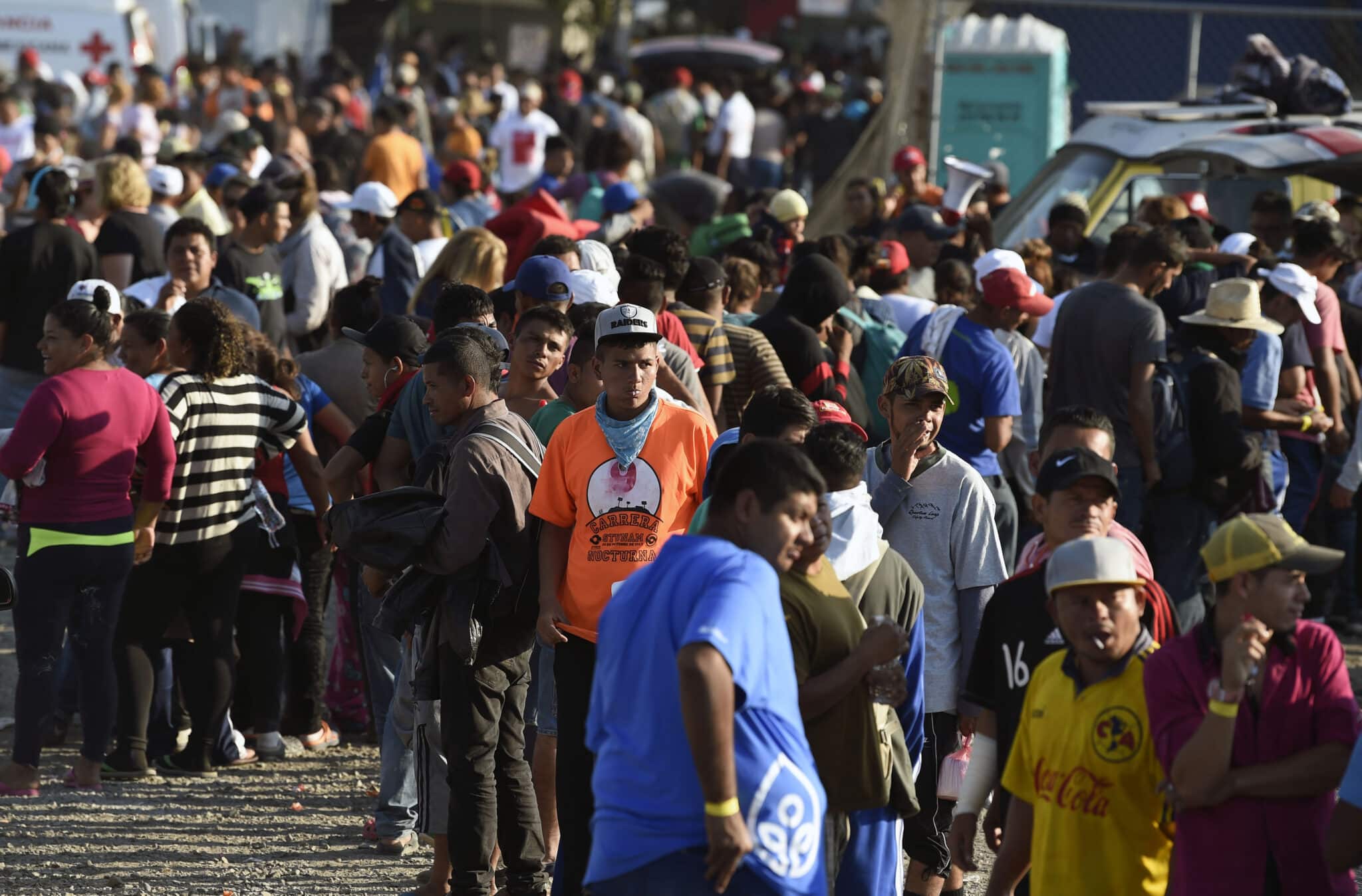 Central American migrants, taking part in a caravan heading to the US, queue to receive a meal at a temporary shelter in Irapuato, Guanajuato state, Mexico on November 11, 2018. - The trek from tropical Central America to the huge capital of Mexico is declining the health of the migrant caravan that endures extreme climate changes, as well as overcrowding and physical exhaustion, and still has to face the desert that leads to the United States. (Photo by ALFREDO ESTRELLA / AFP)        (Photo credit should read ALFREDO ESTRELLA/AFP via Getty Images)
