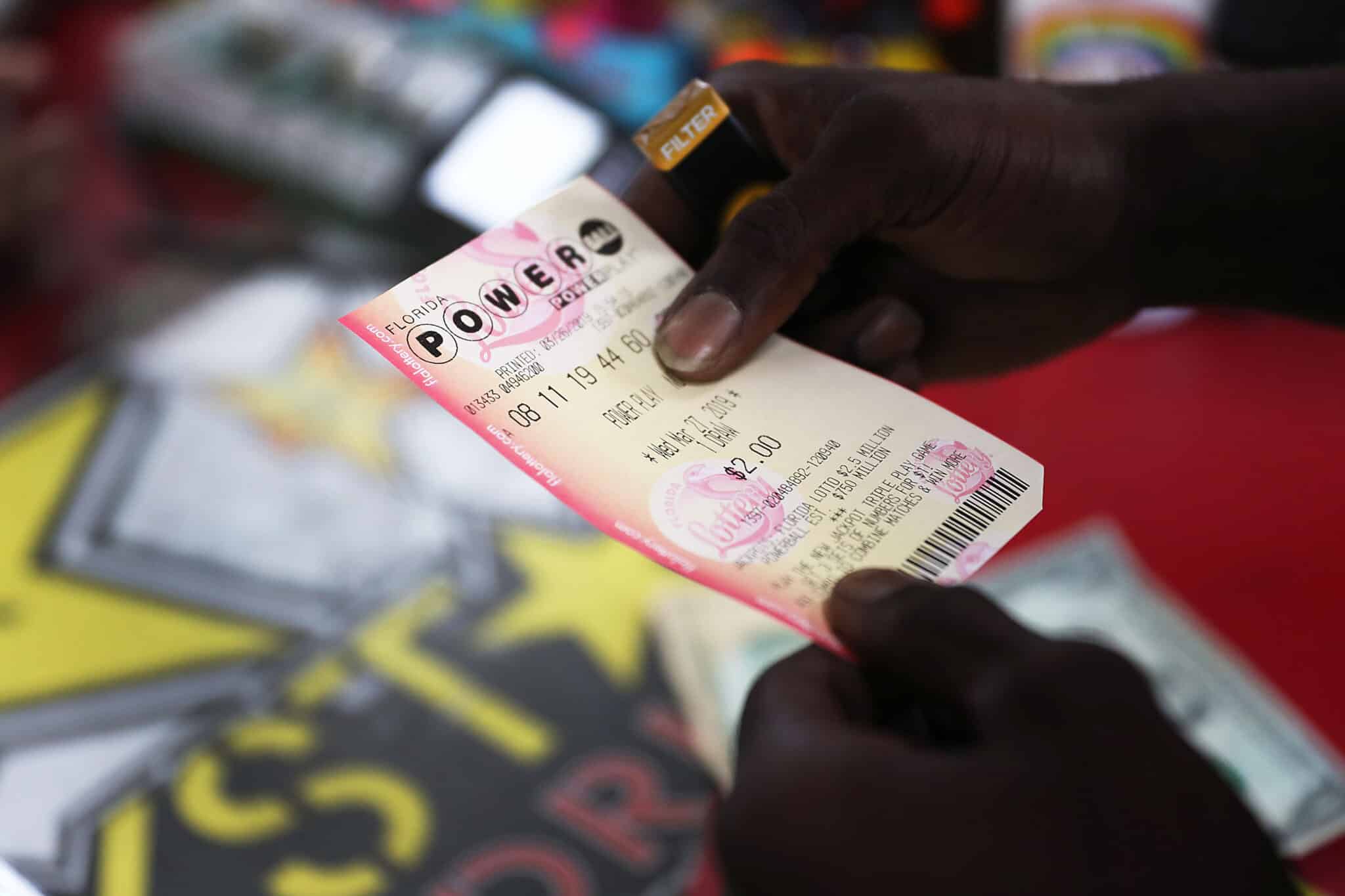 BOYNTON BEACH, FLORIDA - MARCH 26:  George Hollins buys a Powerball ticket at the Shell Gateway store on March 26, 2019 in Boynton Beach, Florida. Wednesday's Powerball drawing will be an approximately $750 million jackpot which would be one of the biggest in US lottery prize history. (Photo by Joe Raedle/Getty Images)
