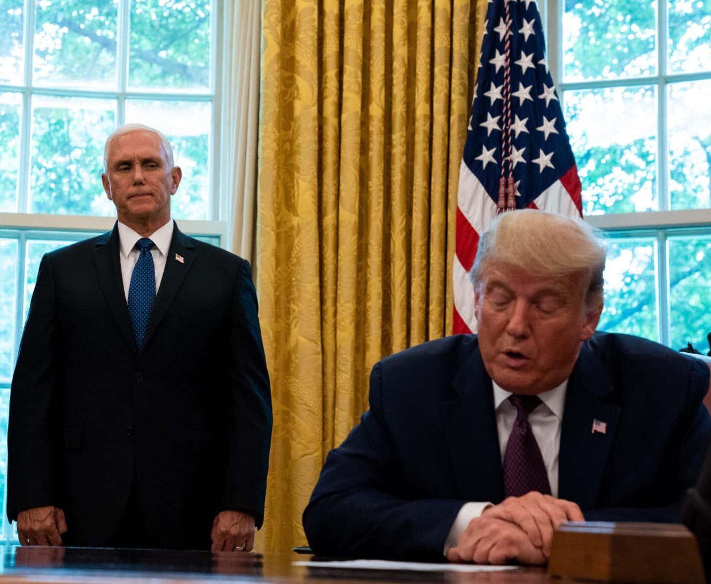 WASHINGTON, DC - SEPTEMBER 11: U.S. President Donald Trump, flanked by U.S. Treasury Secretary Steven Mnuchin (L) and U.S. Vice President Mike Pence (C), speaks in the Oval Office to announce that Bahrain will establish diplomatic relations with Israel, at the White House in Washington, DC on September 11, 2020. The announcement follows one last month by Israel and the United Arab Emirates that they would seek to normalize relations with each other. (Photo by Anna Moneymaker-Pool/Getty Images)