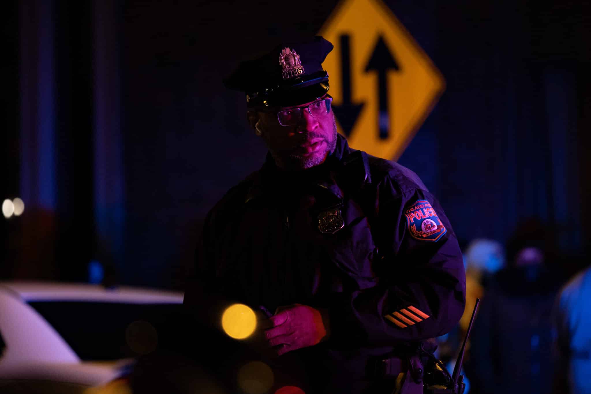 PHILADELPHIA, PA - JANUARY 05: A police officer keeps watch near the scene of the fatal fire in the Fairmount neighborhood on January 5, 2022 in Philadelphia, Pennsylvania. A fire killed 13 people, including seven children, in a Philadelphia rowhouse on Wednesday morning, officials said. (Photo by Hannah Beier/Getty Images)