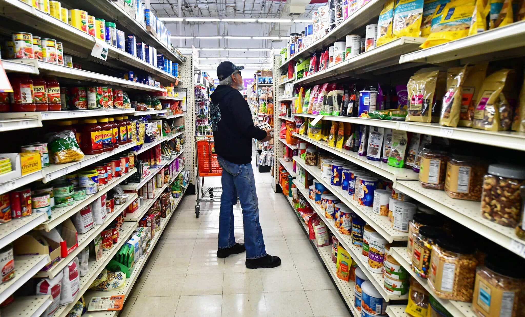 A shopper pauses in the aisle while shopping for food items in Alhambra, California, on April 12, 2022. - Americans paid more for gasoline, food and other essentials last month amid an ongoing wave of record inflation made worse by Russia's invasion of Ukraine, according to government data released Tuesday. (Photo by Frederic J. BROWN / AFP) (Photo by FREDERIC J. BROWN/AFP via Getty Images)