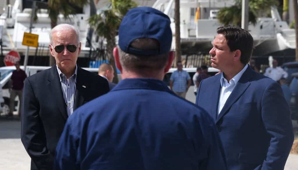 US President Joe Biden, along with Florida Governor Ron DeSantis, receives an operational briefing by federal, local, and state officials on current response and recovery efforts at Fishermans Pass in Fort Myers, Florida, on October 5, 2022. (Photo by OLIVIER DOULIERY / AFP) (Photo by OLIVIER DOULIERY/AFP via Getty Images)