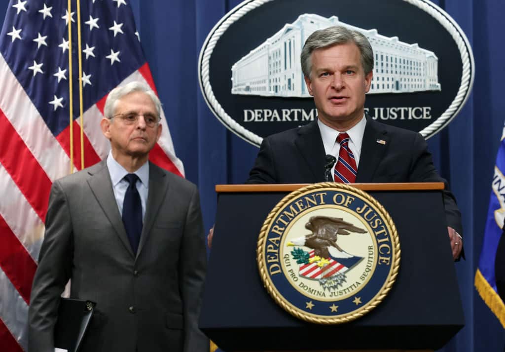 WASHINGTON, DC - OCTOBER 24: F.B.I. Director Christopher Wray (R) and  U.S. Attorney General Merrick Garland speak at a press conference at the U.S. Department of Justice on on October 24, 2022 in Washington, DC. The Justice Department announced it has charged 13 individuals, including members of the Chinese intelligence and their agents, for alleged efforts to unlawfully exert influence in the United States for the benefit of the government of China. (Photo by Kevin Dietsch/Getty Images)