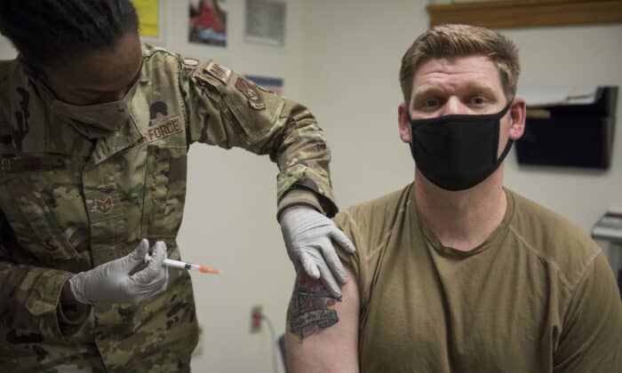 Senior Master Sgt. Andrew Kehl, 8th Civil Engineering Squadron fire chief, receives the Moderna COVID-19 vaccine at Kunsan Air Base, Republic of Korea, Dec. 29, 2020. The Wolfpack received its first shipment of the Moderna COVID-19 vaccine given to healthcare workers, emergency personnel, and first responders. (U.S. Air Force photo by Staff Sgt. Jordan Garner)