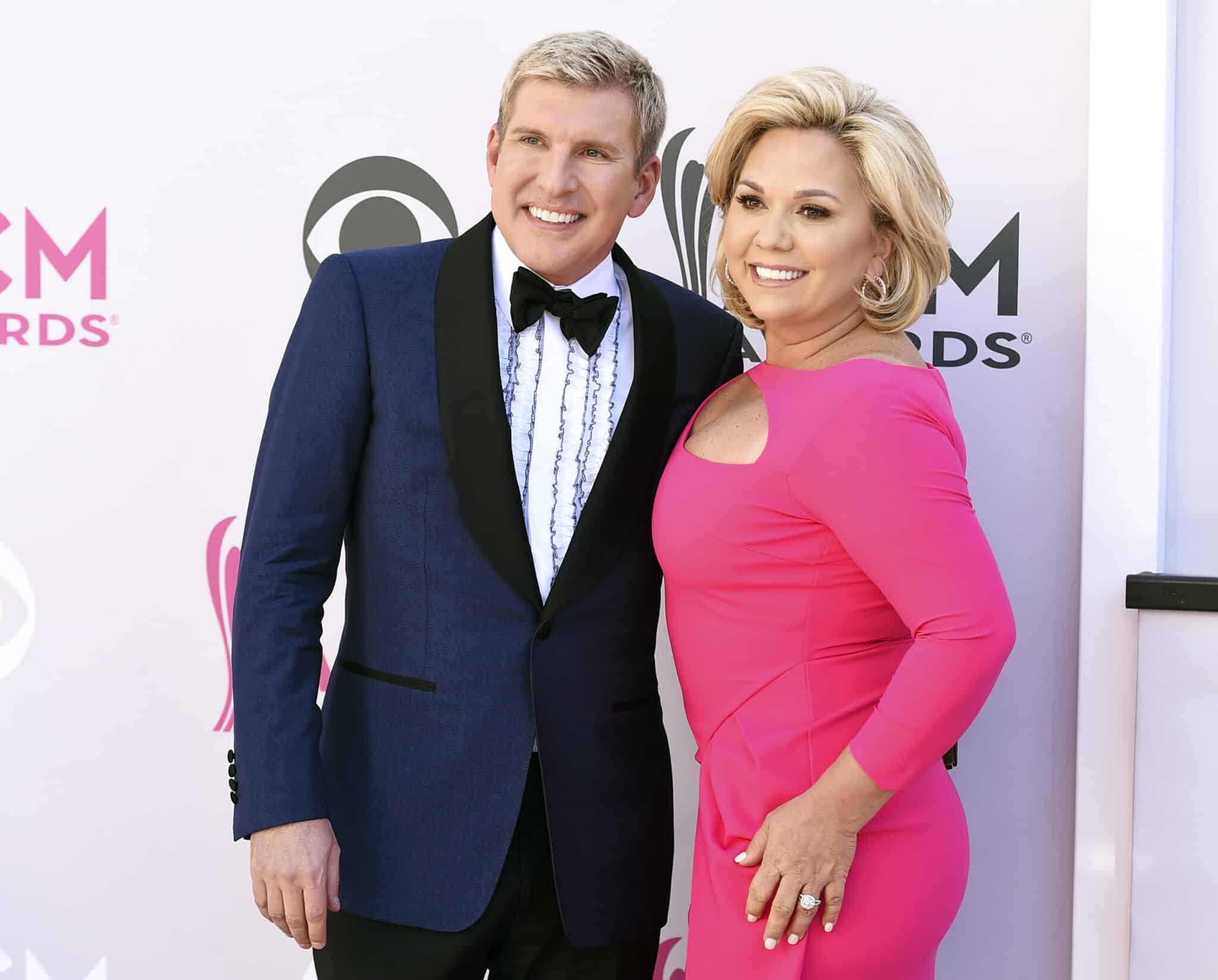 FILE - Todd Chrisley, left, and his wife, Julie Chrisley, pose for photos at the 52nd annual Academy of Country Music Awards on April 2, 2017, in Las Vegas. The couple, stars of the reality television show “Chrisley Knows Best,” have been found guilty in Atlanta on federal charges including bank fraud and tax evasion Tuesday, June 7, 2022. (Photo by Jordan Strauss/Invision/AP, File)