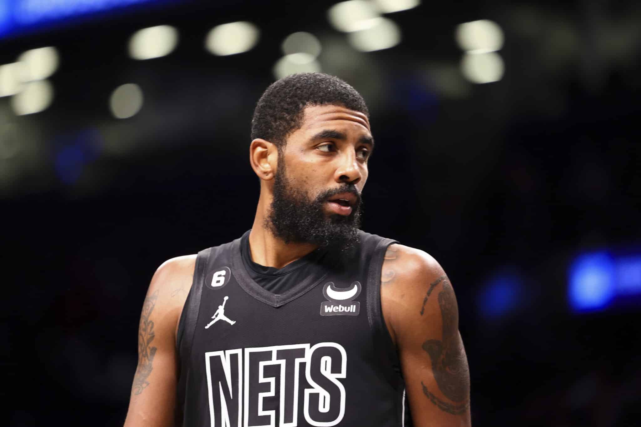 Brooklyn Nets guard Kyrie Irving looks out during the first half of an NBA basketball game against the Indiana Pacers Monday, Oct. 31, 2022, in New York. (AP Photo/Jessie Alcheh)