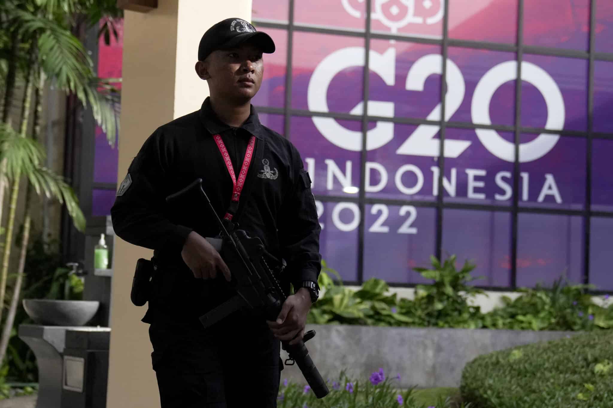 FILE - An Indonesian soldier walks past a G20 sign at one of the venues of the G20 leaders summit, in Nusa Dua, Bali, Indonesia, on Nov. 14, 2022. President Biden and other leaders of the Group of 20 leading economies will meet in Bali, a tropical island in Indonesia, this week. The gathering is the first G-20 summit since before the pandemic to include face-to-face talks between the leaders.  (AP Photo/Dita Alangkara, File)