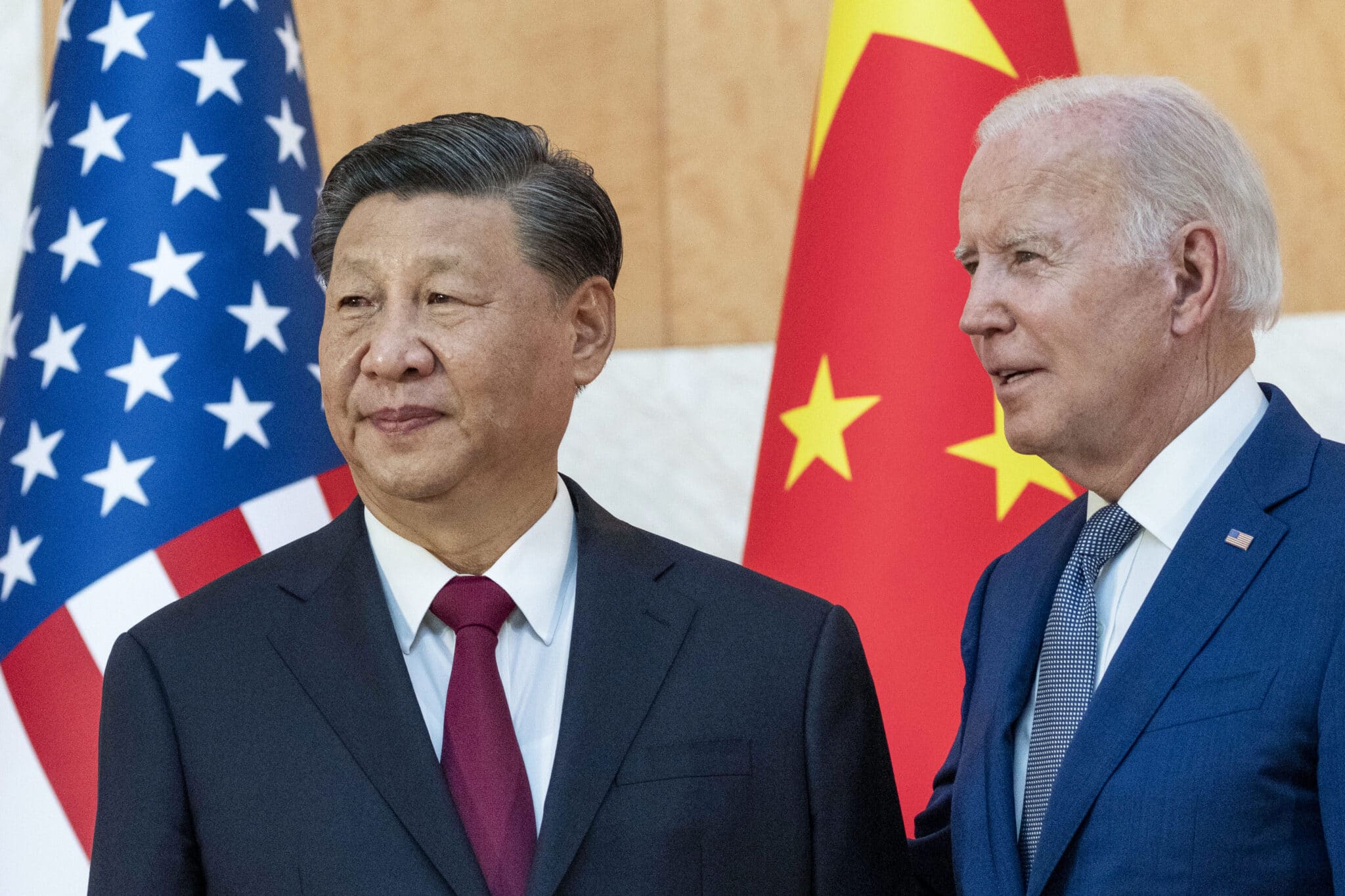 U.S. President Joe Biden, right, stands with Chinese President Xi Jinping before a meeting on the sidelines of the G20 summit meeting, Monday, Nov. 14, 2022, in Bali, Indonesia. Biden says Chinese counterpart Xi has agreed to resume crucial talks on climate between the two countries. The Chinese and U.S. leaders met Monday on the sidelines of the Group of 20 summit in Bali. (AP Photo/Alex Brandon)