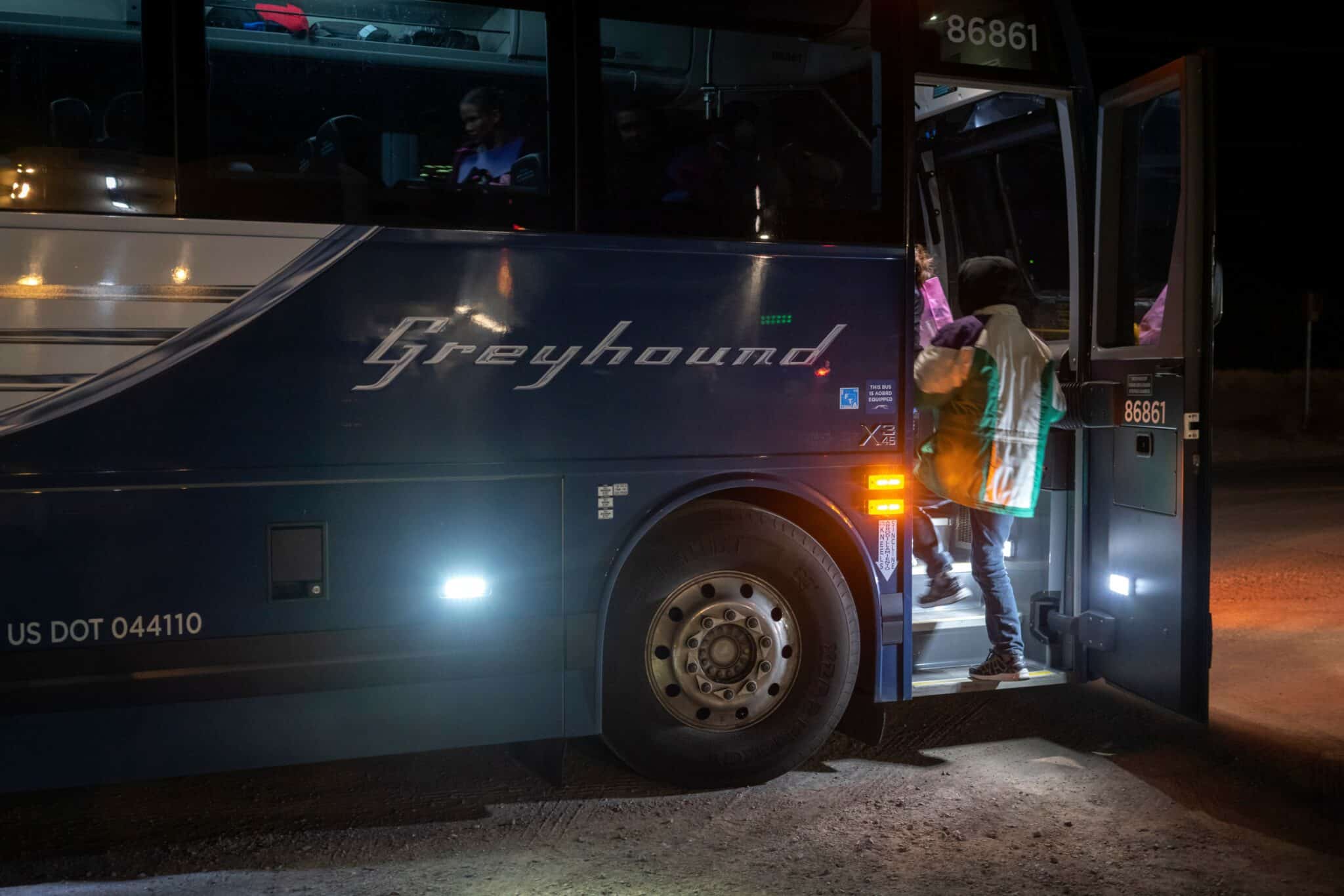 Ricardo Chub-Bo, 40, and his daughter Rosa Maria, 14, from Poptun in El Petun department, Guatemala, board the Greyhound bus they will take to Albuquerqe before their three-day journey through the United States to Philadelphia on January 3, 2019 in Dona Ana, New Mexico. - They spent eight days in migration detention and were released with a group of about 20 Central American migrants to the Basilica of San Albino in Mesilla, New Mexico, which provided them hospitality the night of their release.  Ricardo relies on his daughter to help read letters and numbers, while she relies on him to communicate in Spanish, as she still isnt used to speaking it. The two speak to each other in their mother tongue of K'iche', a Maya language spoken in the central highlands of Guatemala. The church had provided them with a piece of paper that asks for help finding the connection in English and a phone number to call if they need help. For them, luckily, they ran into another group of Guatemalans going on the same bus, which they could team up with in case they had trouble. (Photo by Paul Ratje / AFP)        (Photo credit should read PAUL RATJE/AFP via Getty Images)