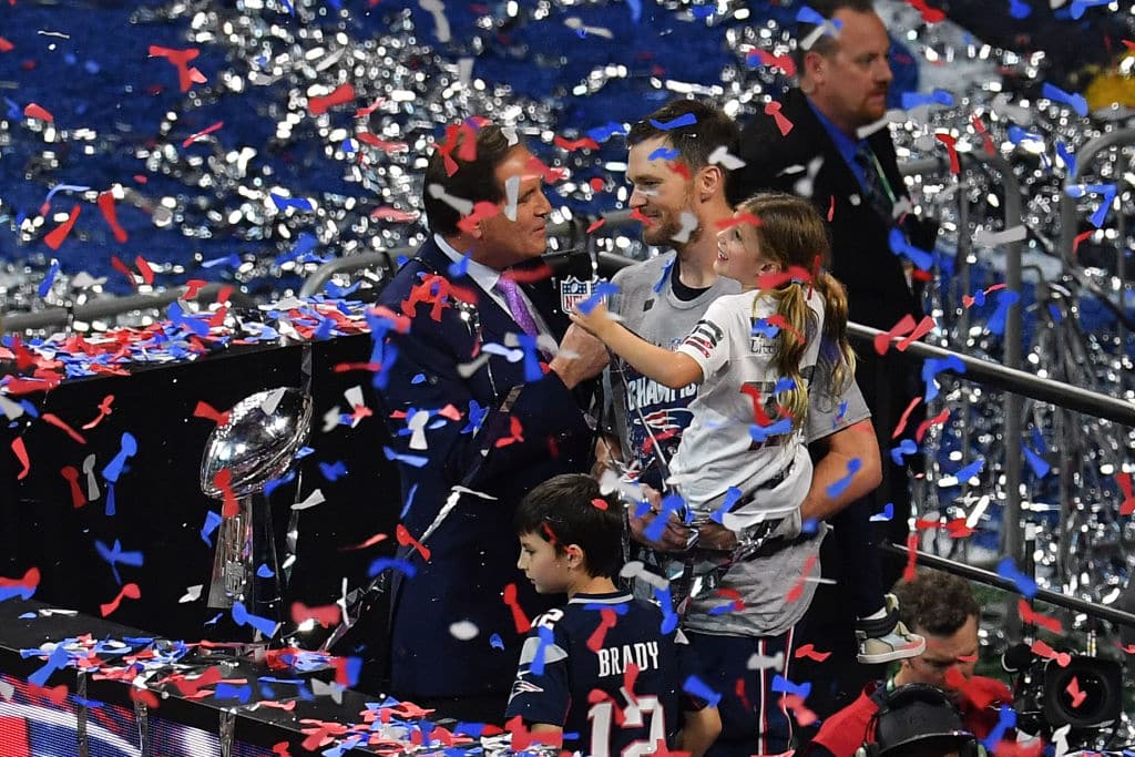 Quarterback for the New England Patriots Tom Brady stands with his children near the trophy as he celebrates after winning Super Bowl LIII against the Los Angeles Rams at Mercedes-Benz Stadium in Atlanta, Georgia, on February 3, 2019. (Photo by Angela Weiss / AFP)        (Photo credit should read ANGELA WEISS/AFP via Getty Images)