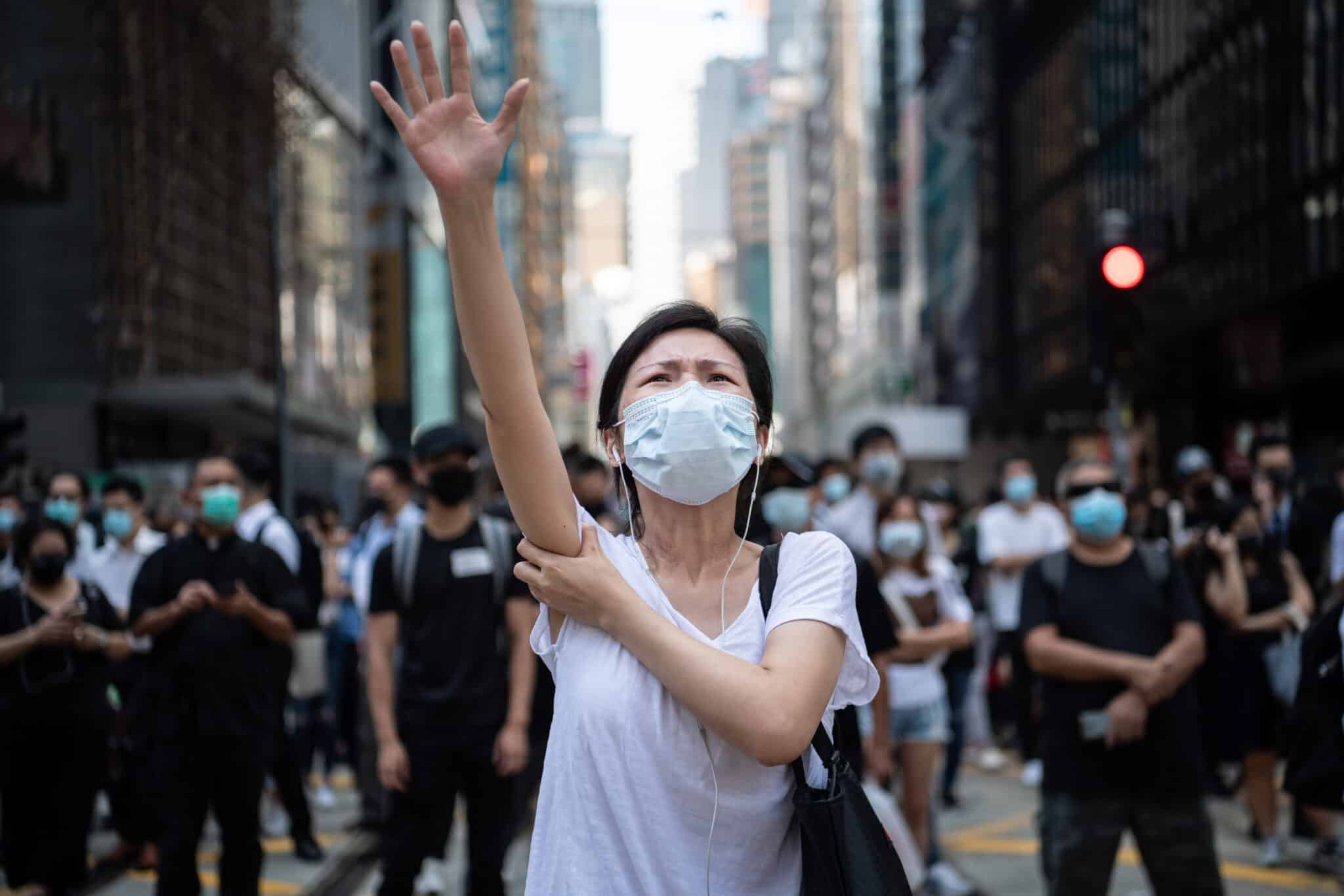 HONG KONG, CHINA - OCTOBER 4: People protest a government ban on face masks in Central on October 4, 2019 in Hong Kong, China. Hong Kong's government invoked emergency powers on Friday to introduce an anti-mask law which bans people from wearing masks at public assemblies as the city remains on edge with the anti-government movement entering its fourth month. Pro-democracy protesters marked the 70th anniversary of the founding of the People's Republic of China in Hong Kong as one student protester was shot in the chest in the Tsuen Wan district during with mass demonstrations across Hong Kong. Protesters in Hong Kong continue to call for Chief Executive Carrie Lam to meet their remaining demands since the controversial extradition bill was withdrawn, which includes an independent inquiry into police brutality, the retraction of the word riot to describe the rallies, and genuine universal suffrage, as the territory faces a leadership crisis. (Photo by Laurel Chor/Getty Images)