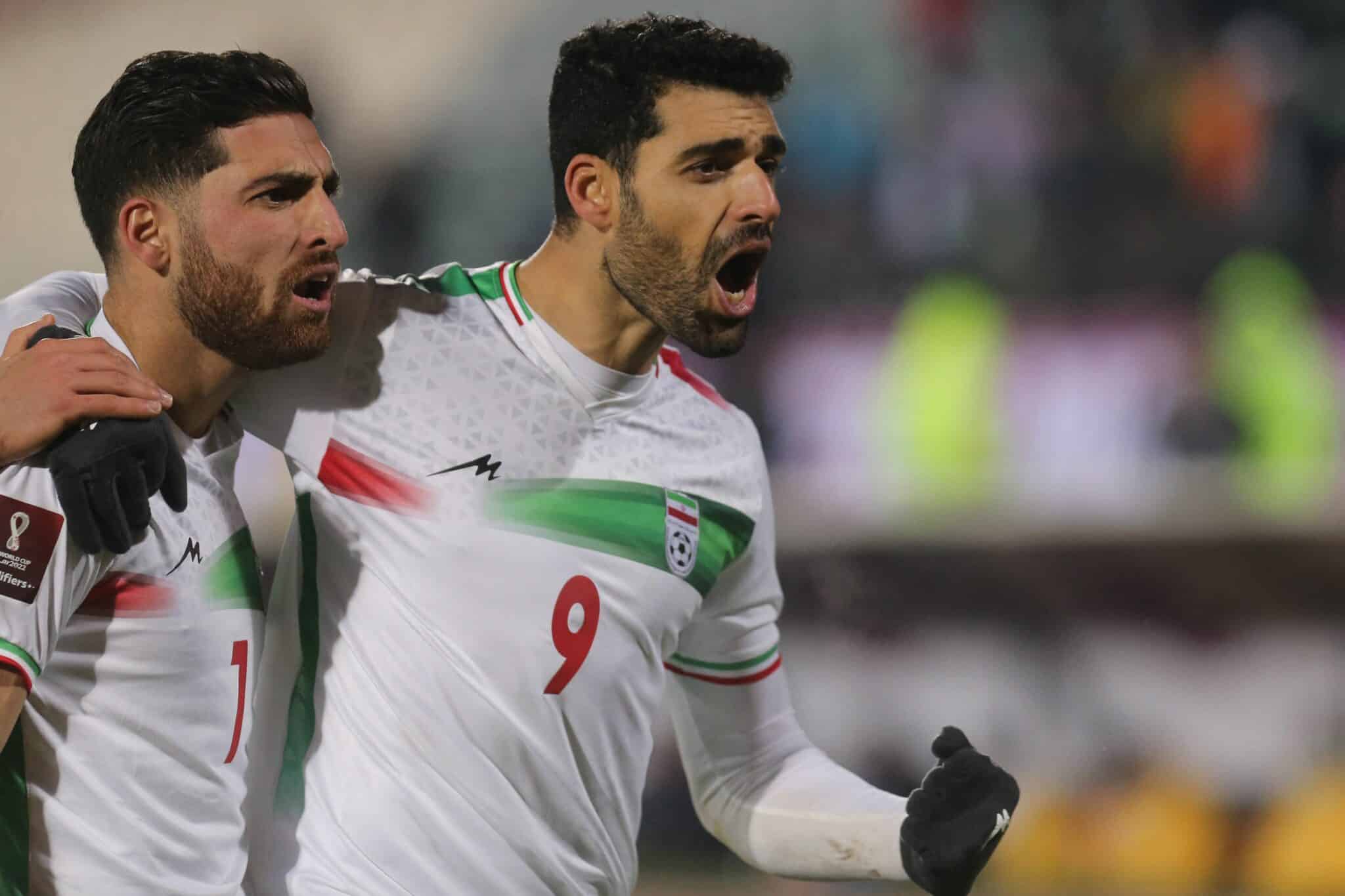 Iran's forward Mehdi Taremi (R) celebrates his opening goal with his teammates during the 2022 Qatar World Cup Asian Qualifiers football match between Iran and Iraq, at the Azadi Sports Complex in the capital Tehran, on January 27, 2022. (Photo by Atta KENARE / AFP) (Photo by ATTA KENARE/AFP via Getty Images)