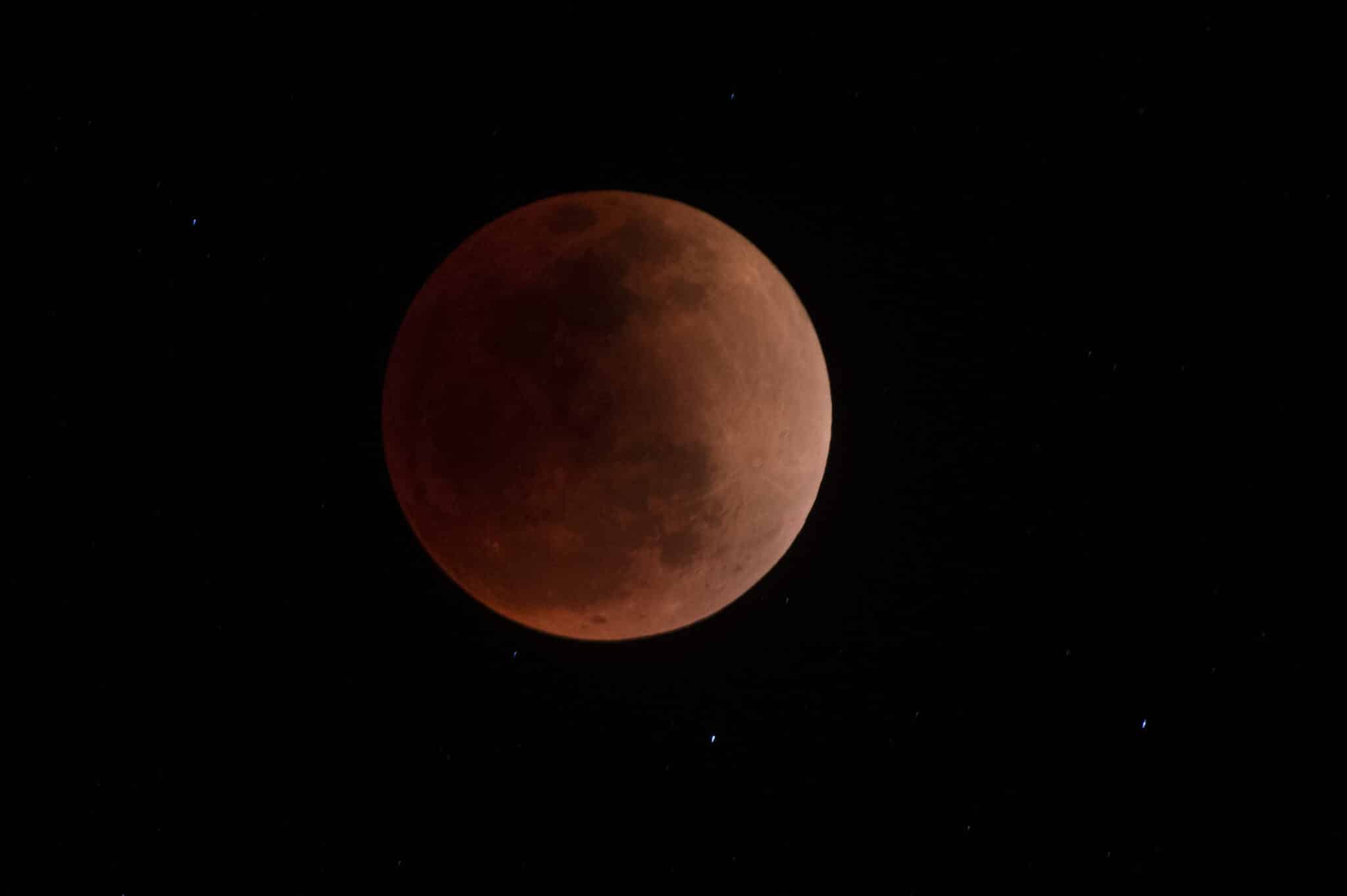 The blood moon is seen during a total lunar eclipse in Canta, east of Lima on May 15, 2022. (Photo by ERNESTO BENAVIDES / AFP) (Photo by ERNESTO BENAVIDES/AFP via Getty Images)