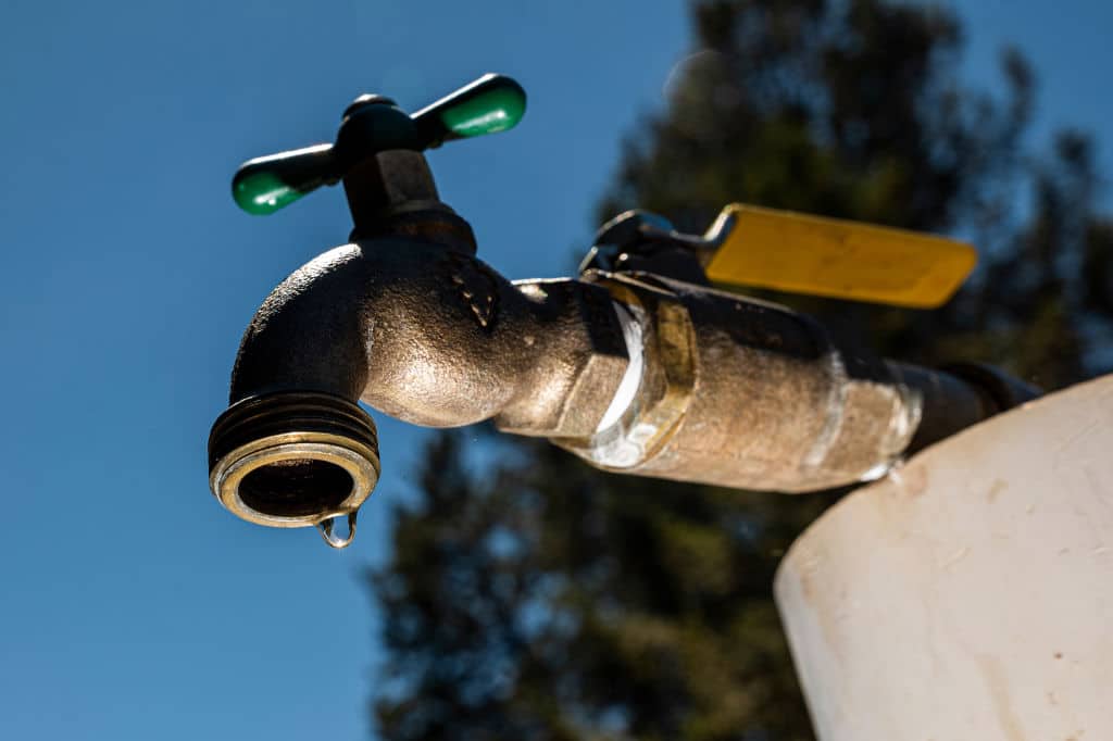 Water drips from a faucet at Lake Mendocino during a drought in Mendocino County, California, US, on Wednesday, Aug. 10, 2022. California water prices are at all-time high as a severe drought chokes off supplies to cities and farms across the Golden State. Photographer: David Paul Morris/Bloomberg via Getty Images