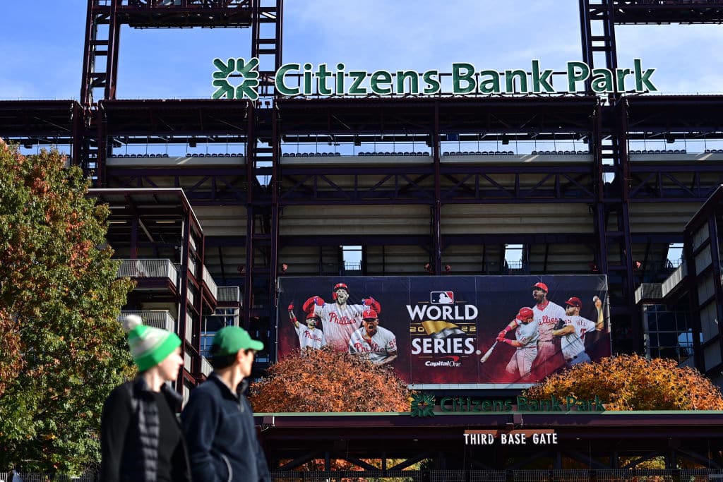 PHILADELPHIA, PA - OCTOBER 30: Eagles fans walk past a World Series banner at Citizens Bank Park between the Philadelphia Phillies and Houston Astros with game 3 tomorrow on October 30, 2022 in Philadelphia, Pennsylvania. Wearing a jersey with his last name, Democratic candidate for Governor Josh Shapiro tailgated with supporters across the street before attending the game between the Philadelphia Eagles and Pittsburgh Steelers . (Photo by Mark Makela/Getty Images)