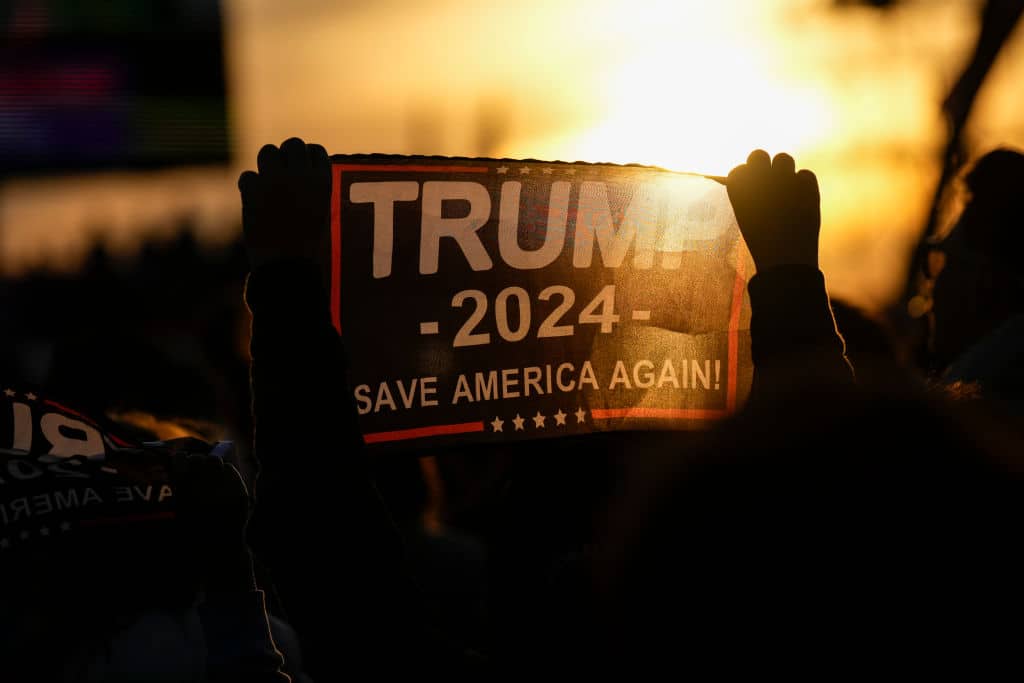 VANDALIA, OHIO - NOVEMBER 7:  Supporters of former U.S. President Donald Trump await his arrival at a rally for Ohio Republicans at the Dayton International Airport on November 7, 2022 in Vandalia, Ohio. Trump is campaigning for Republican candidates, including U.S. Senate candidate JD Vance, who faces U.S. Rep. Tim Ryan (D-OH) in tomorrow's general election. (Photo by Drew Angerer/Getty Images)