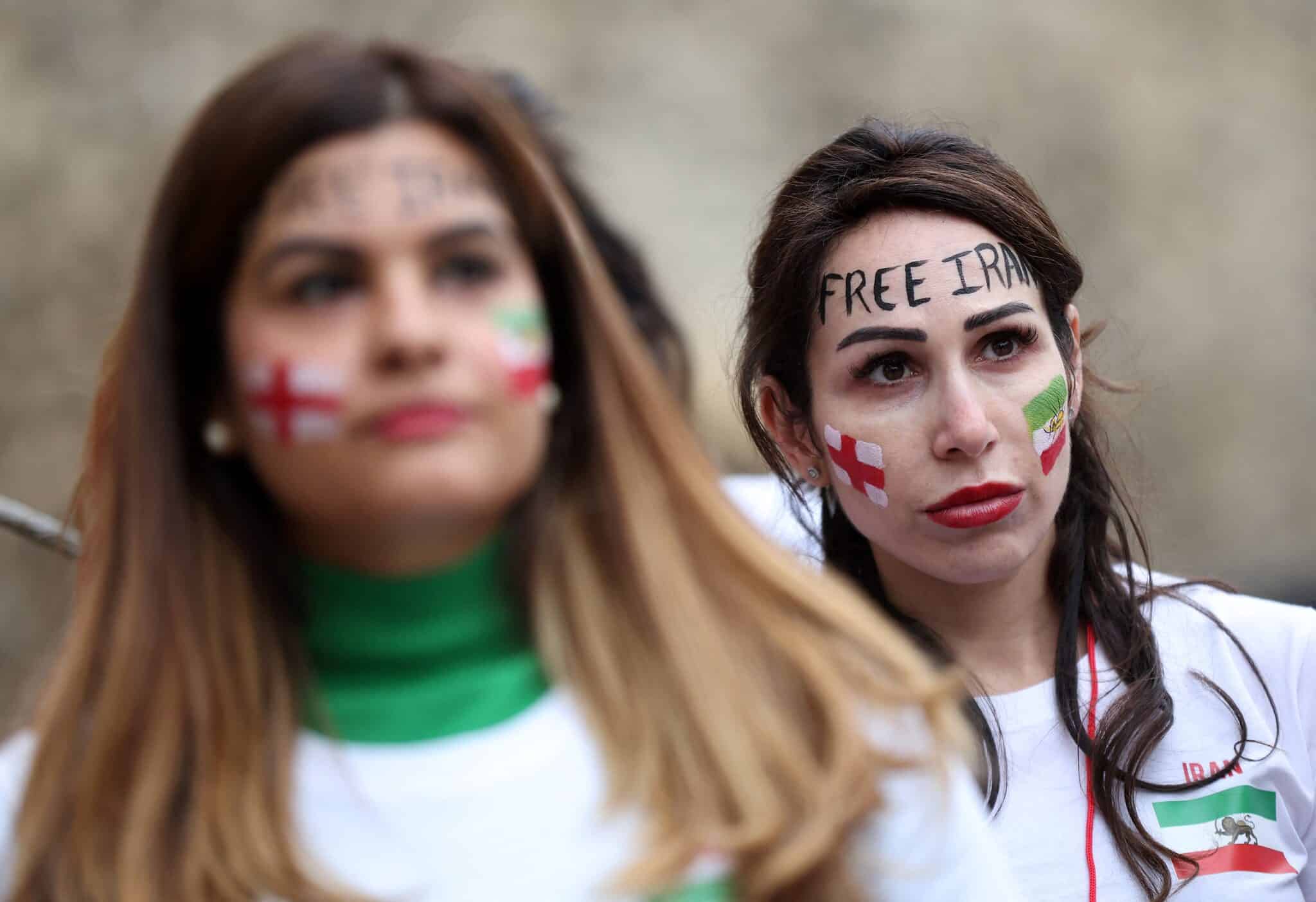 British-Iranian women take part in a demonstration opposite the Houses of Parliament in central London on November 19, 2022, ahead of Iran's fixture against England in the 2022 FIFA World Cup. - The 22 women protestors are calling for people in Iran and around the world to protest at the start of every world cup match played by Iran, by blowing a football whistle for one minute at the start of each match. (Photo by ISABEL INFANTES / AFP) (Photo by ISABEL INFANTES/AFP via Getty Images)