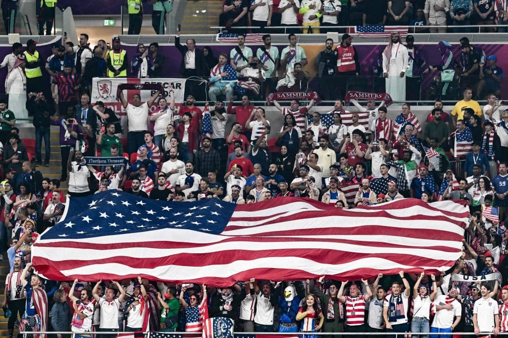 Fans of USA display a national flag on the stands ahead of the Qatar 2022 World Cup Group B football match between USA and Wales at the Ahmad Bin Ali Stadium in Al-Rayyan, west of Doha on November 21, 2022. (Photo by Jewel SAMAD / AFP) (Photo by JEWEL SAMAD/AFP via Getty Images)